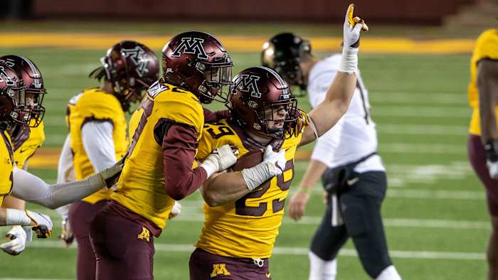 Minnesota Golden Gophers linebacker Josh Aune (29) celebrates with defensive back Tyler Nubin (27) after intercepting a pass in the fourth quarter against the Purdue Boilermakers at TCF Bank Stadium.